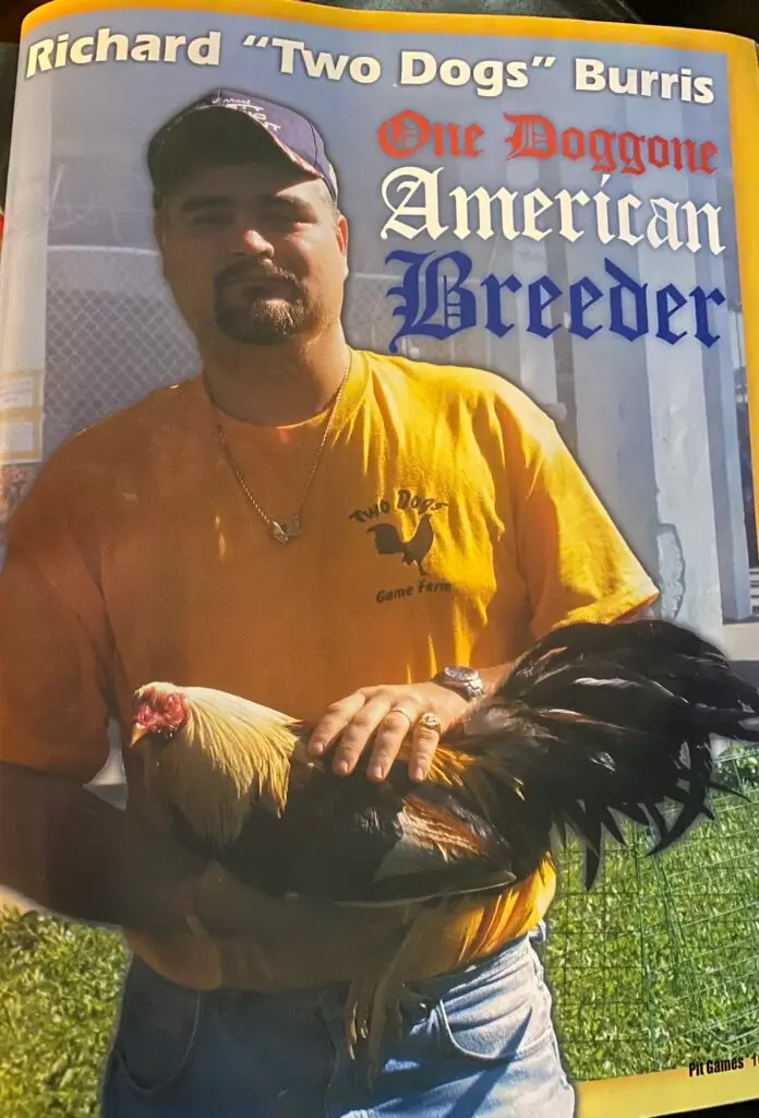 Richard “Two Dogs” Burris of Two Dogs Game Farm holding his rooster Manila